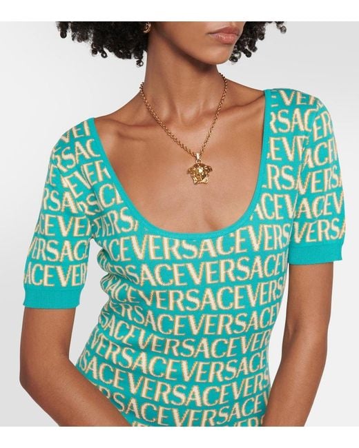Monogramm Strick -Mini -Kleid Versace de color Green