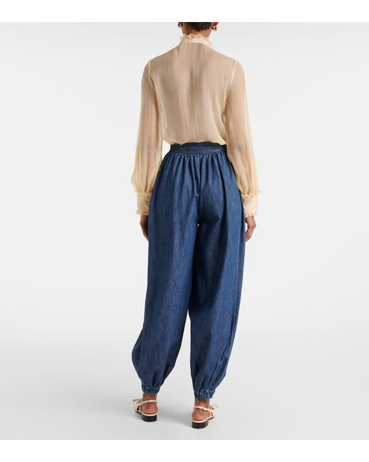 【関税＆送料込み】Valentino Garavani Trousers In Chambray Valentino Garavani Chambray Denim Pants with Bow - Bergdorf