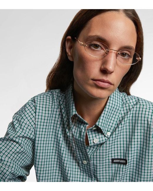 Miu Miu Metallic Oval Logo Glasses