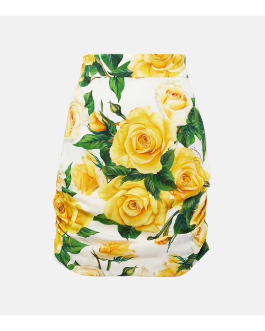 Mini-jupe en soie melangee a fleurs Dolce & Gabbana en coloris Yellow