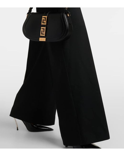 Pantalones anchos de mezcla de lana de tiro alto Versace de color Black