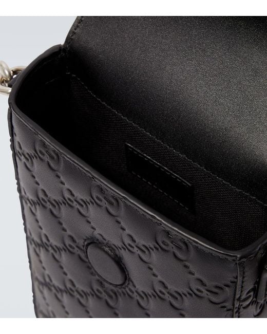 Gucci Black Gg Emblem Debossed Leather Phone Pouch for men