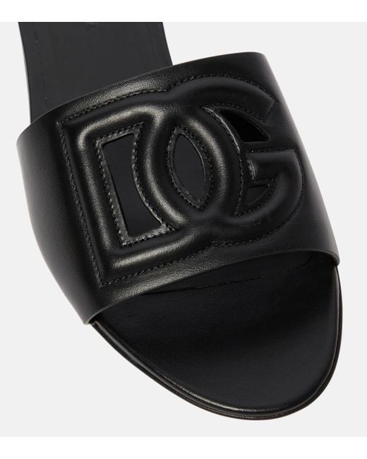 Mules DG en cuir Dolce & Gabbana en coloris Black