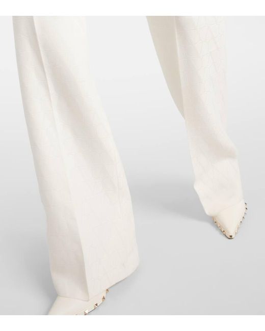 Pantalones anchos de lana y seda cpn tiro alto Valentino de color Natural