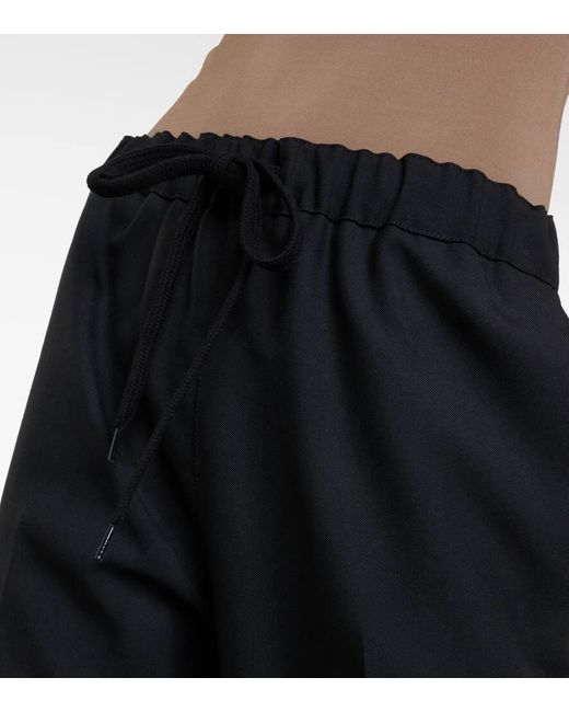 Pantalones tapered plisados MM6 by Maison Martin Margiela de color Black