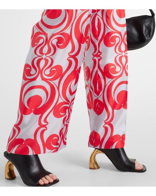 Pantaloni in seta con stampa di Dries Van Noten in Red