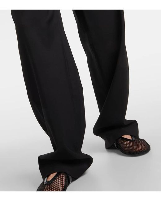 Pantalones anchos de lana de tiro alto Alaïa de color Black