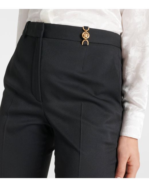 Pantalon evase a taille haute en laine Versace en coloris Black