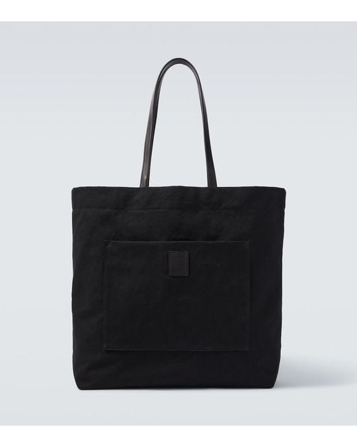 The Row Black Tori Leather-Trimmed Canvas Tote Bag for men