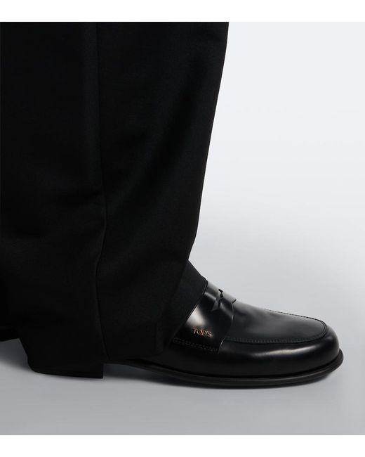 Tod's Black Leather Penny Loafers