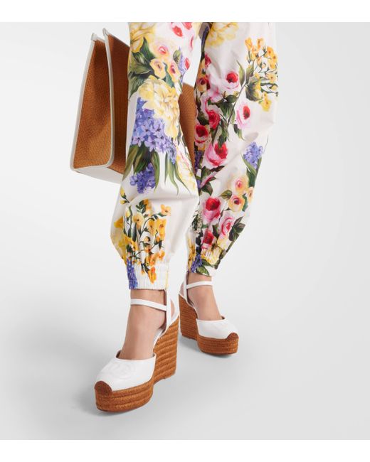 Pantalon fusele en coton a fleurs Dolce & Gabbana en coloris White