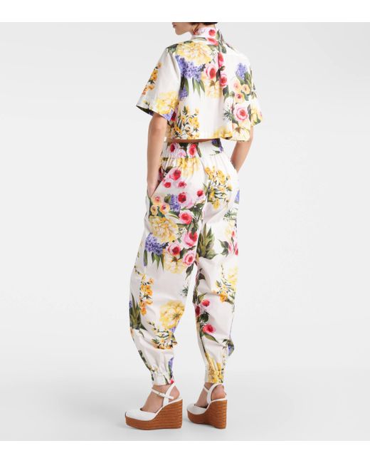 Pantalon fusele en coton a fleurs Dolce & Gabbana en coloris White