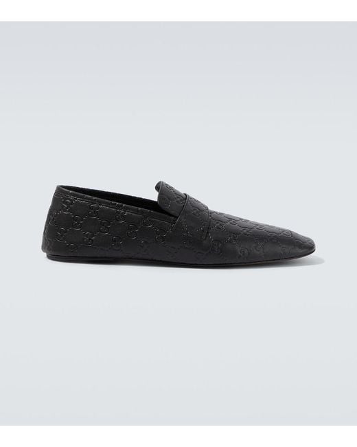 Gucci Black Gg Embossed Leather Loafers for men