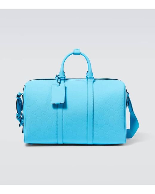 Gucci Blue GG Debossed Pvc Duffel Bag for men