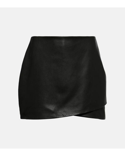 The Sei Asymmetric Leather Miniskirt in Black