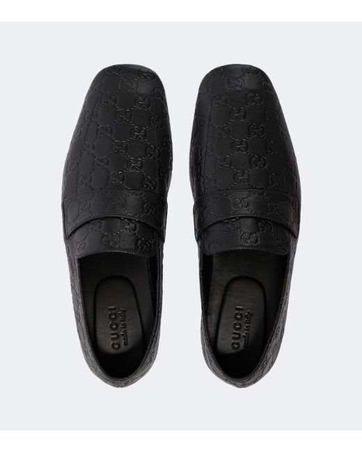 Gucci Black Gg Embossed Leather Loafers for men
