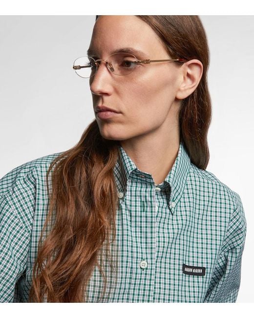 Miu Miu Metallic Oval Logo Glasses
