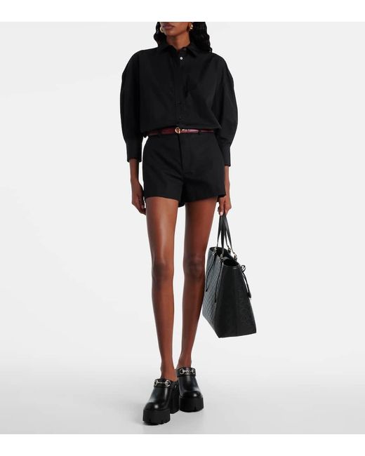 Mules Horsebit di Gucci in Black