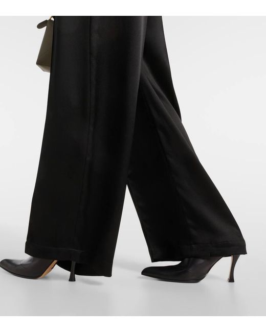 Pantaloni a gamba larga in seta di Loewe in Black