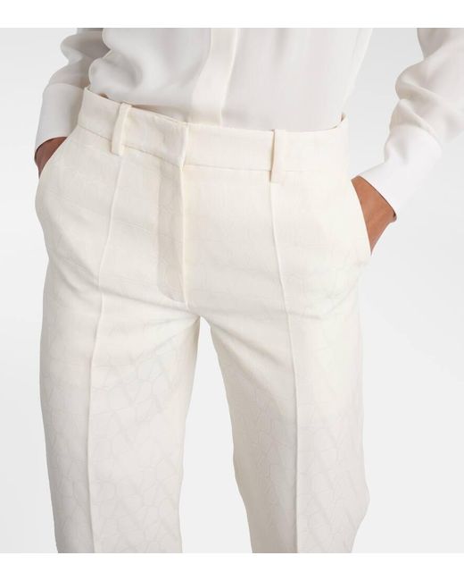 Pantalones anchos de lana y seda cpn tiro alto Valentino de color Natural