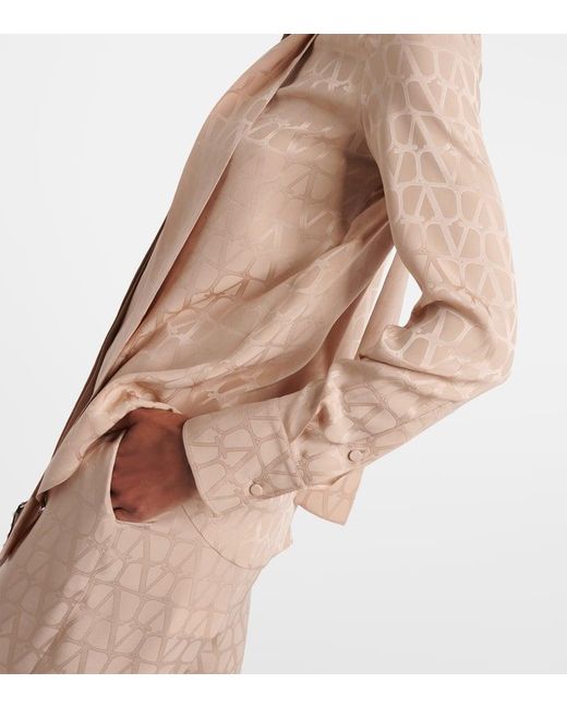Blusa de seda con lazada y monograma Valentino de color Natural