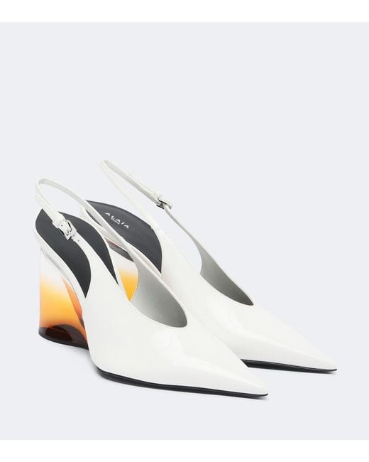 Alaïa White Invisible Leather Wedge Pumps