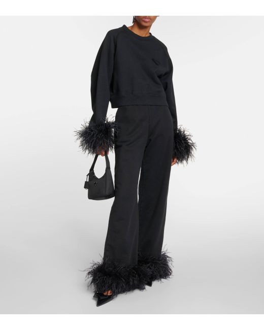 Pantalon de survetement en coton a plumes Prada en coloris Black