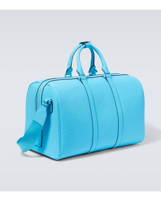 Bolso de viaje de PVC con GG grabada Gucci de hombre de color Blue