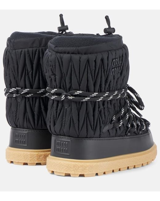 Botas De Nieve En Matelasse Con Logo Miu Miu de color Black