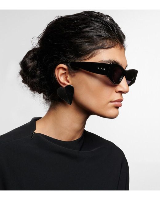 Alaïa Blue Logo Oval Sunglasses
