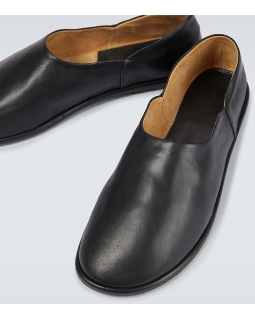 The Row Black Canal Slip-On Leather Shoes for men