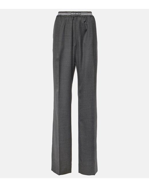 Pantaloni a vita bassa in lana di Miu Miu in Gray