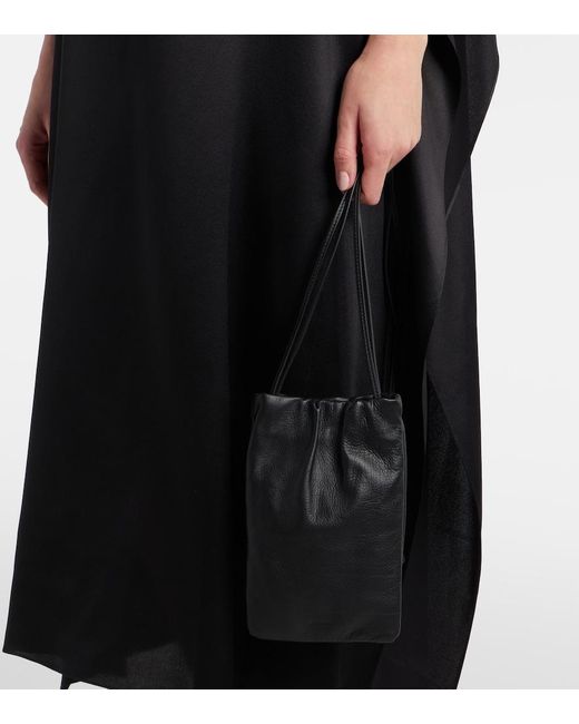 The Row Black Bourse Leather Phone Pouch