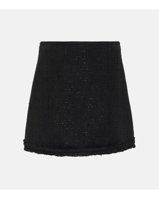 Mini-jupe en tweed Versace en coloris Black