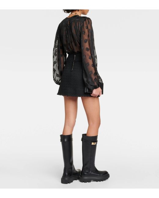 Mini-jupe en tweed de laine melangee Dolce & Gabbana en coloris Black