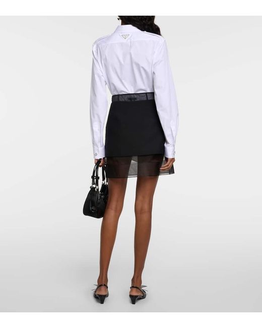 Minifalda de tiro alto Prada de color Black