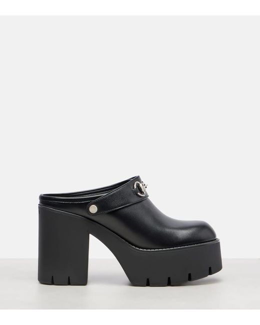 Mules Horsebit di Gucci in Black