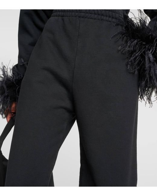 Pantalones deportivos de algodon con plumas Prada de color Black