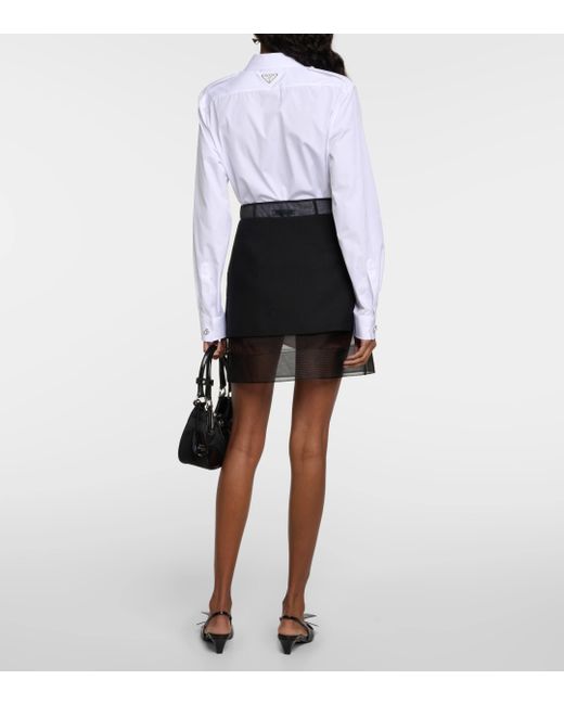 Mini-jupe a taille haute Prada en coloris Black