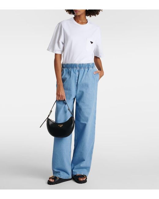 Jeans anchos con logo Prada de color Blue