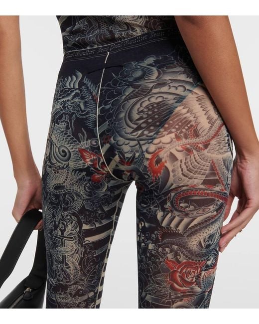 X KNWLS pantalones flared Tattoo Collection de tul Jean Paul Gaultier de color Blue