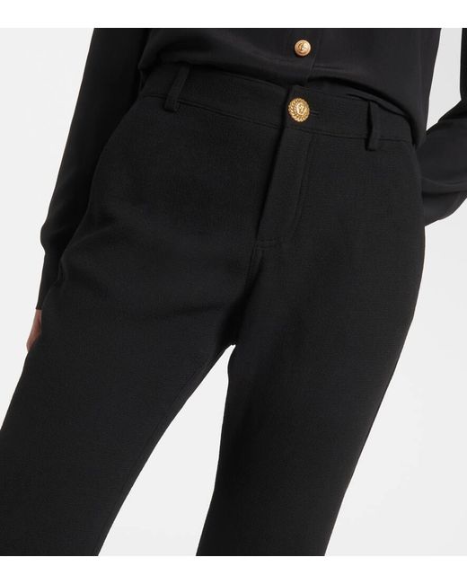 Pantaloni bootcut in crepe di lana vergine di Balmain in Black
