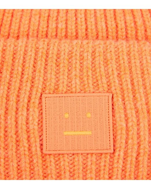 Berretto Pansy in maglia di lana a coste di Acne in Orange