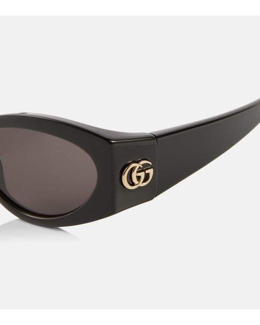 Occhiali da sole ovali GG di Gucci in Brown
