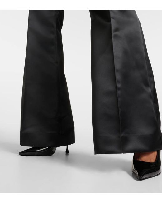 Pantaloni flared in raso di Nina Ricci in Black