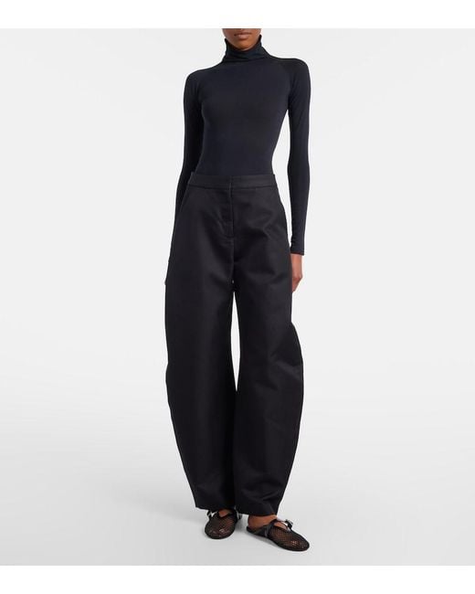 Alaïa Black Fishnet Leather-Trimmed Mules