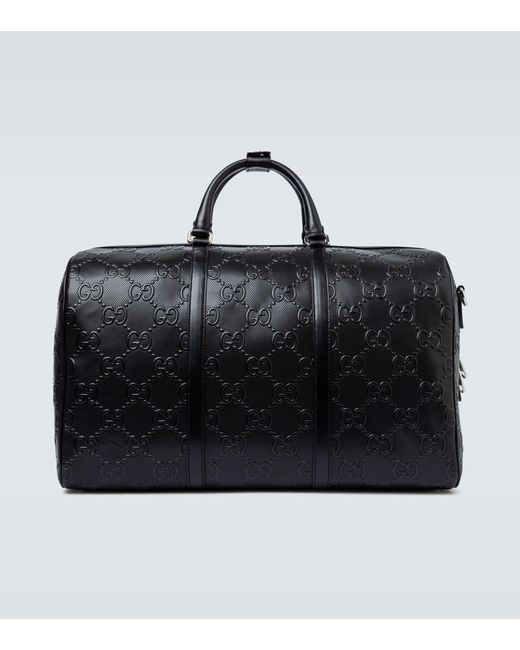 Bolsa de viaje con gg en relieve Gucci de hombre de color Negro | Lyst