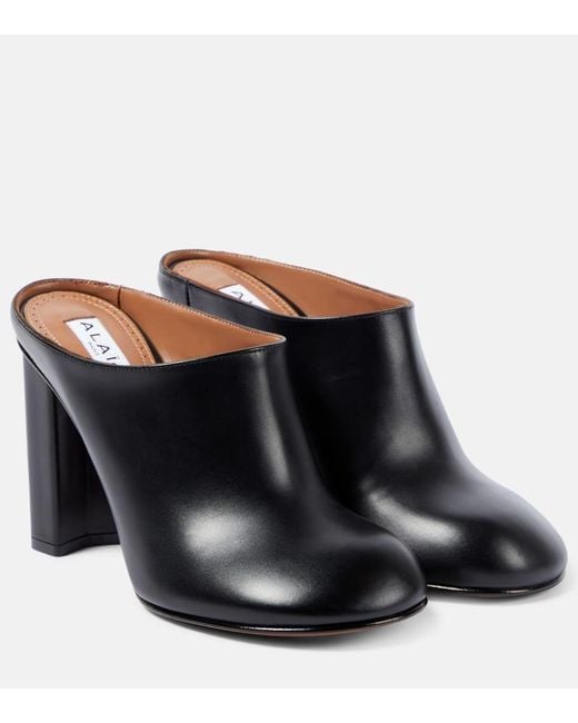 Mules Babylone di Alaïa in Black
