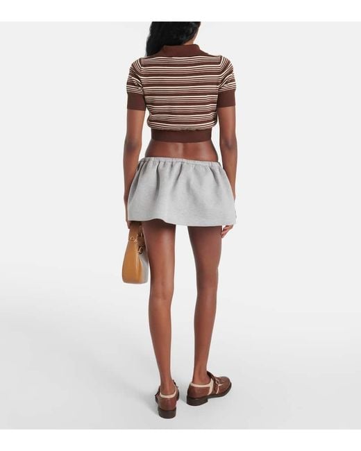 Mini-Jupe En Coton A Logo Miu Miu en coloris Gray