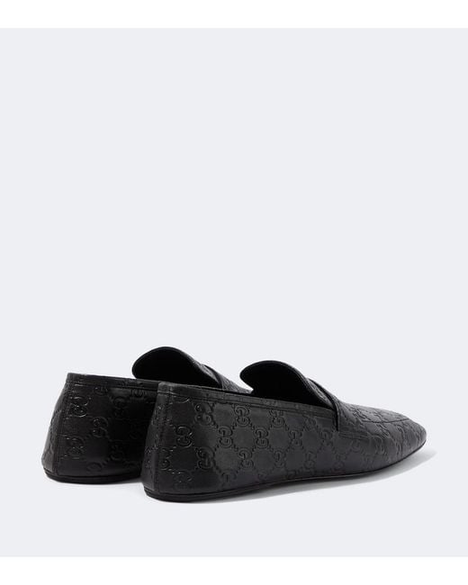 Gucci Black Gg Embossed Leather Loafers for men